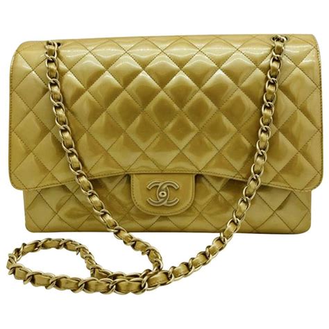 chanel gold bag 2015|Chanel bag with gold chain.